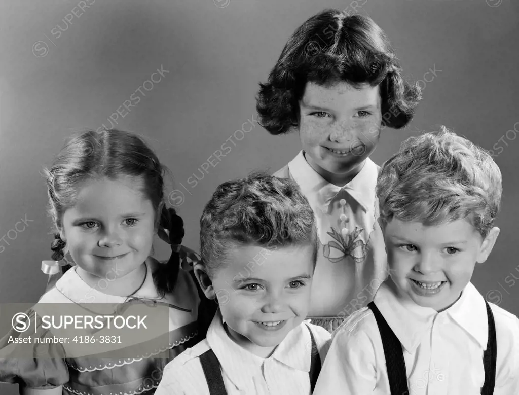1950S Portrait Of Four Smiling Children Two Boys And Two Girls