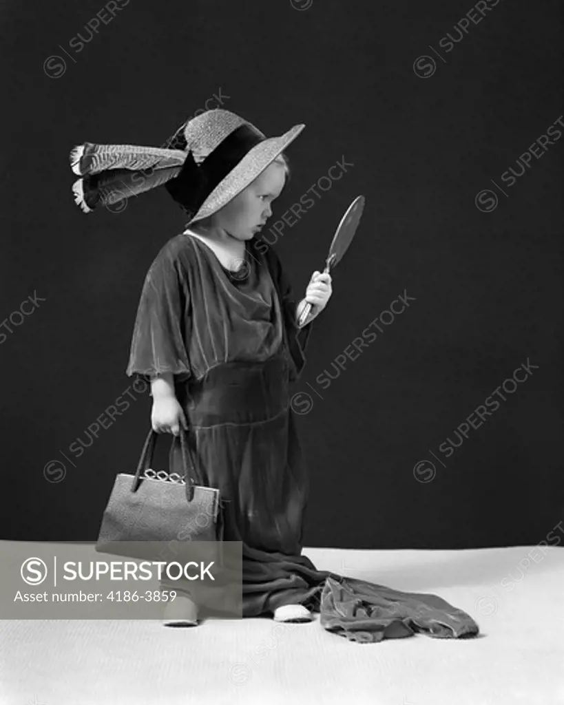 1930S 1940S Girl Playing Dress-Up Looking At Herself In Hand Mirror