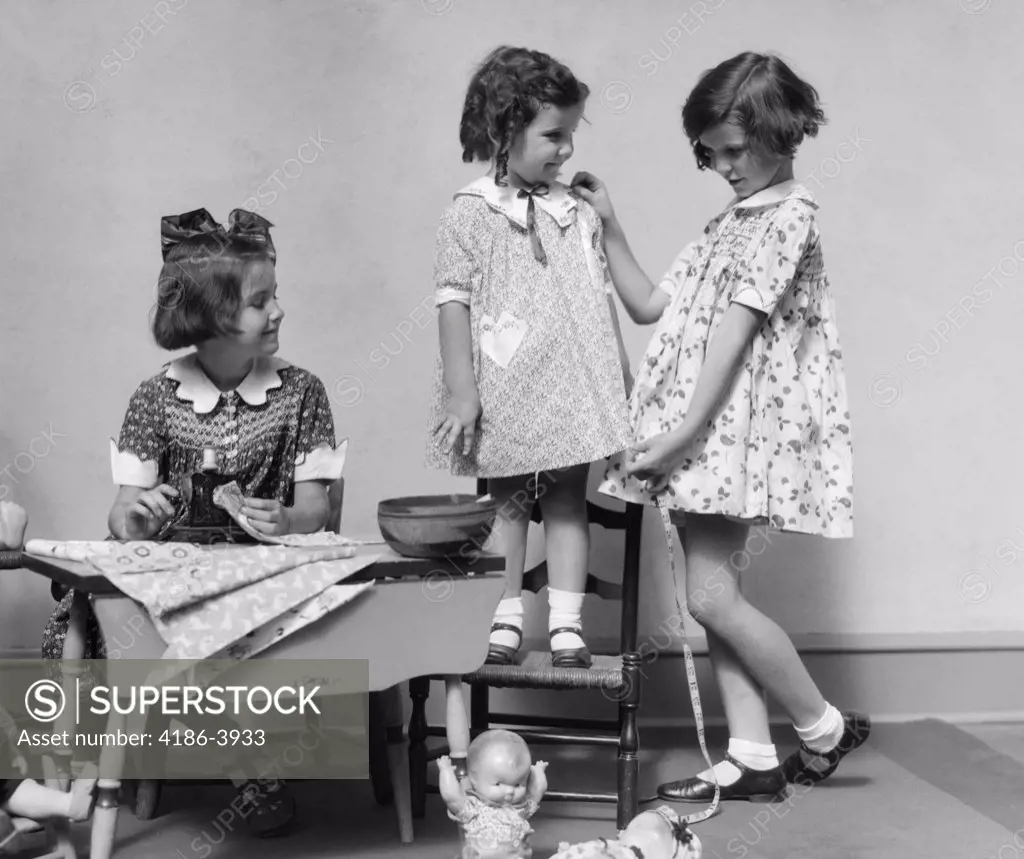 1930S Three Girls Playing Fashion Seamstress Pretending Measuring Fabric