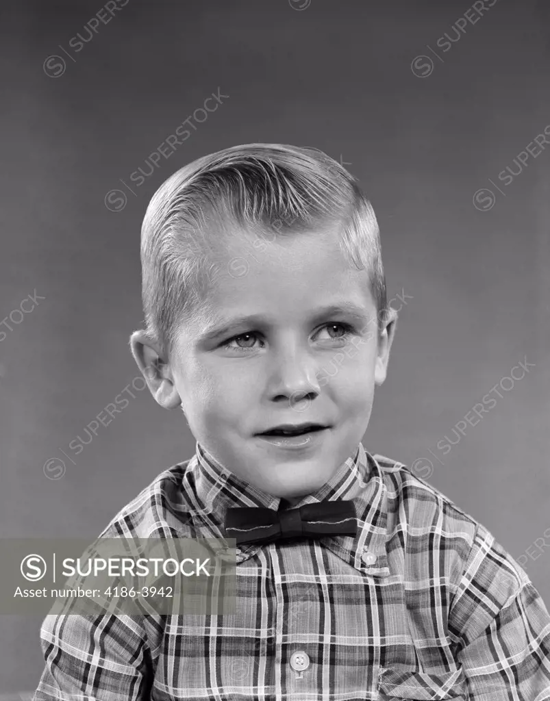 1950S 1960S Portrait Smiling Blond Boy Wearing Plaid Madras Shirt And Bow Tie  