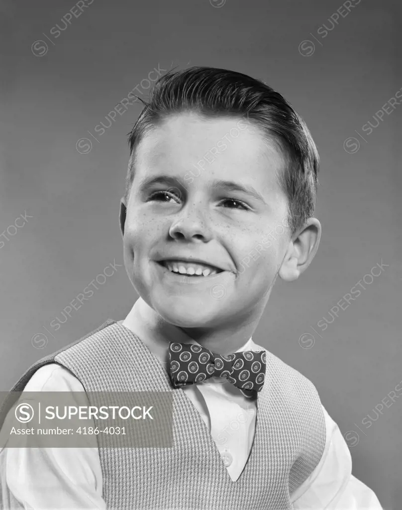 1950S Smiling Boy Portrait Wearing Checked Vest Polka Dot Bow Tie School Picture