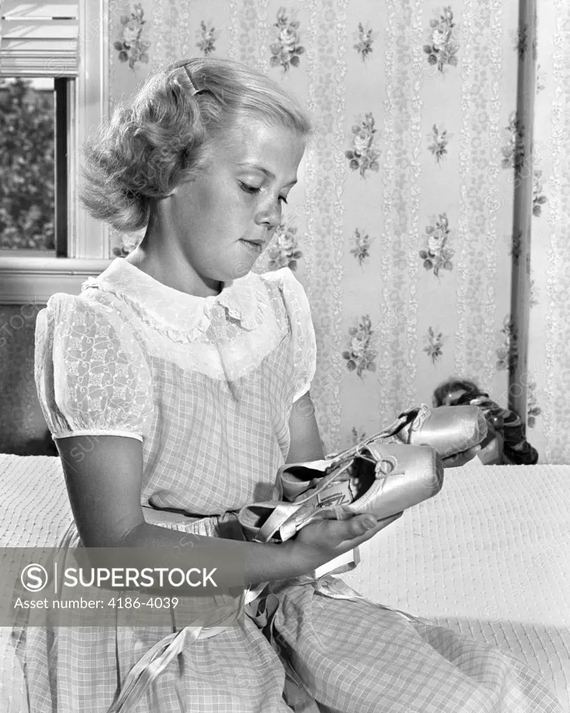 1950S Young Pre-Teen Teen Girl Looking Wistfully At Her Ballet Slippers