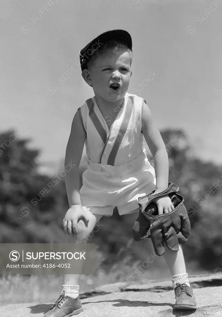 1930S Boy Wearing Baseball Hat & Glove Bent Over With Hands On Knees Yelling
