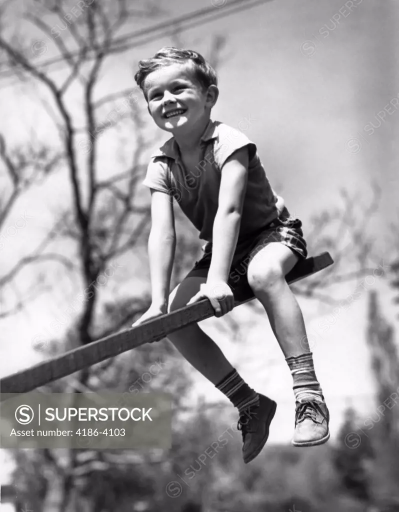 1930S 1940S Boy On Seesaw Smiling