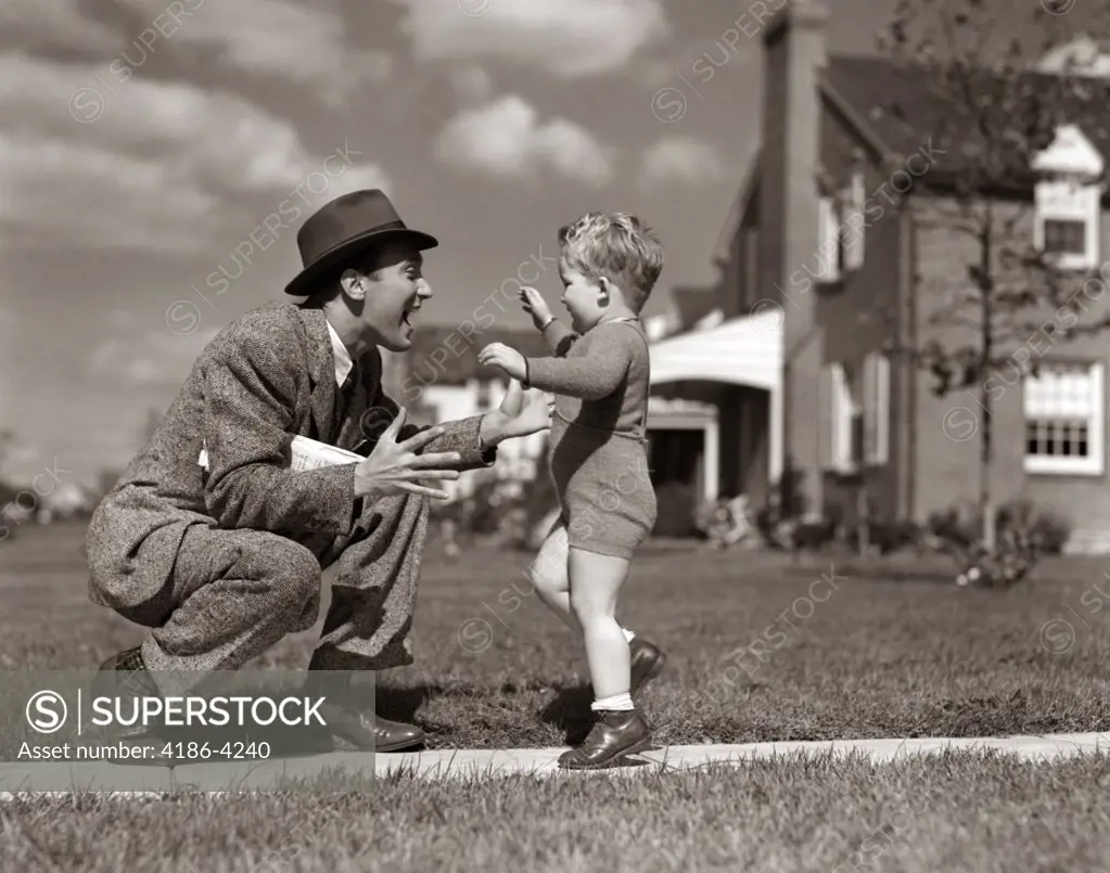 1940S Father Greeting Son Running Towards Him On Sidewalk