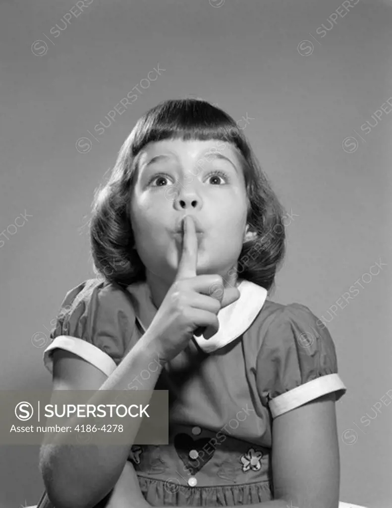 1950S Girl Making Quiet Silence Shush Gesture Finger To Lips