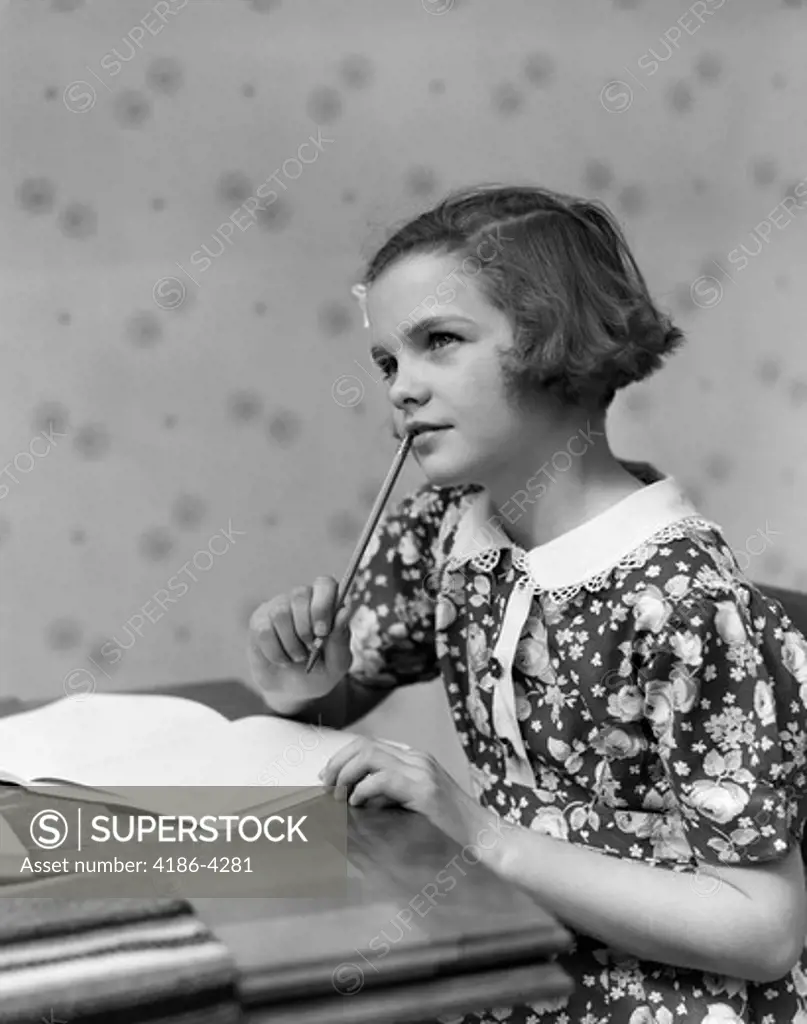 1930S Girl Thinking Sitting At Table Doing Homework