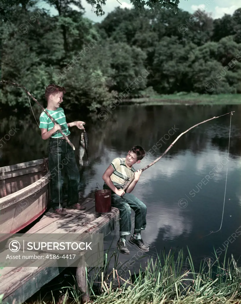 1950S Two Boys Fishing In Lake From Dock Outdoor 