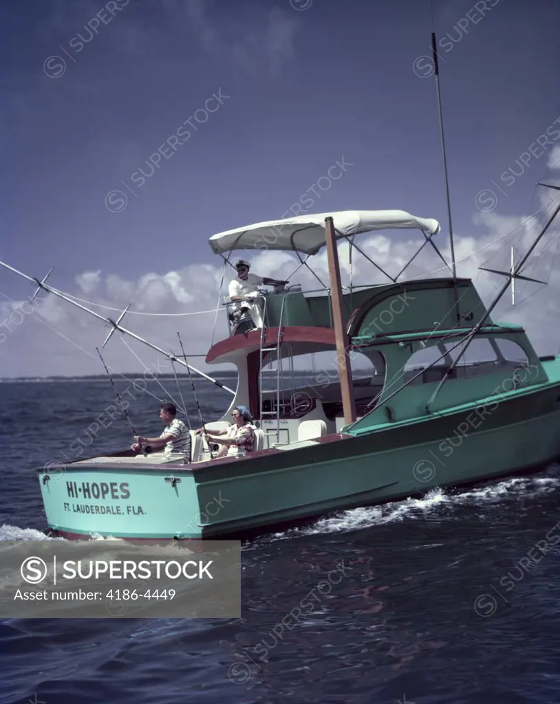 1950S Turquoise Green Fishing Boat On Water Man Woman Fishing Off Stern Man At Helm Bimini Cover Ft. Lauderdale Fl