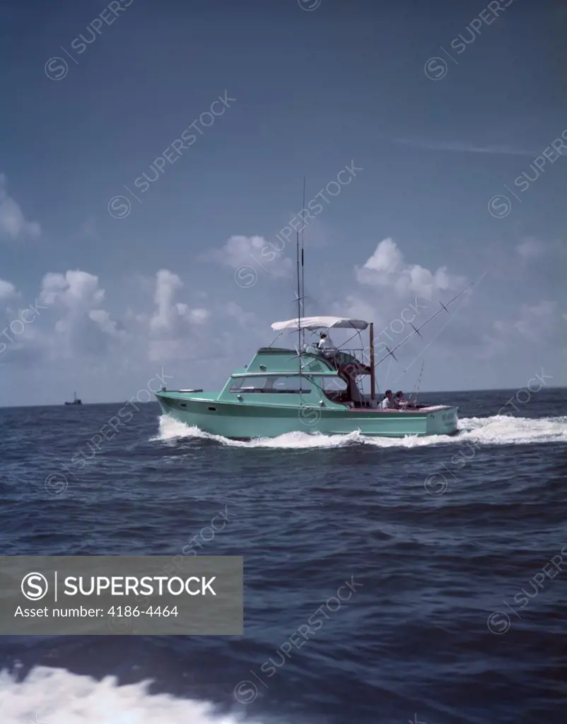 1950S Charter Fishing Boat Turquoise Breaking White Wave Wake In Deep Blue Water Sport Fishing Florida