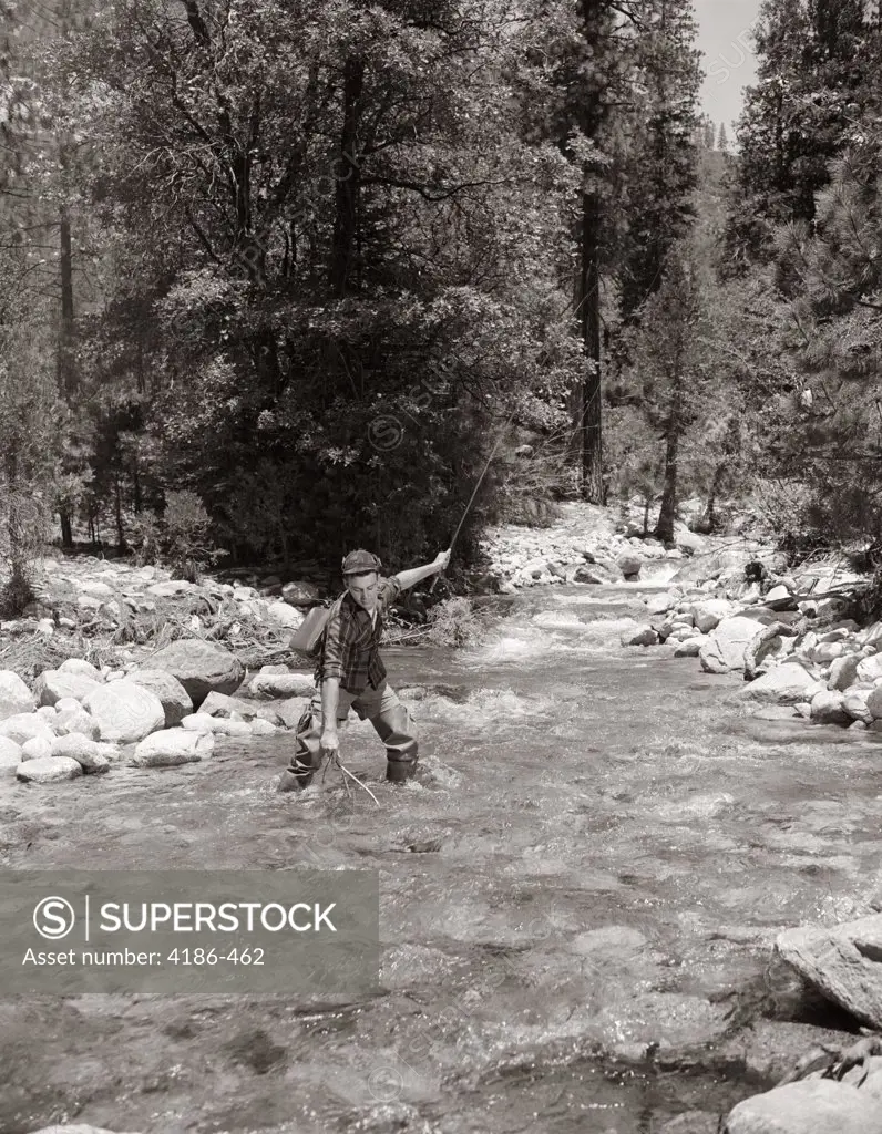 1950S Man Fly Fishing In Mountain Stream