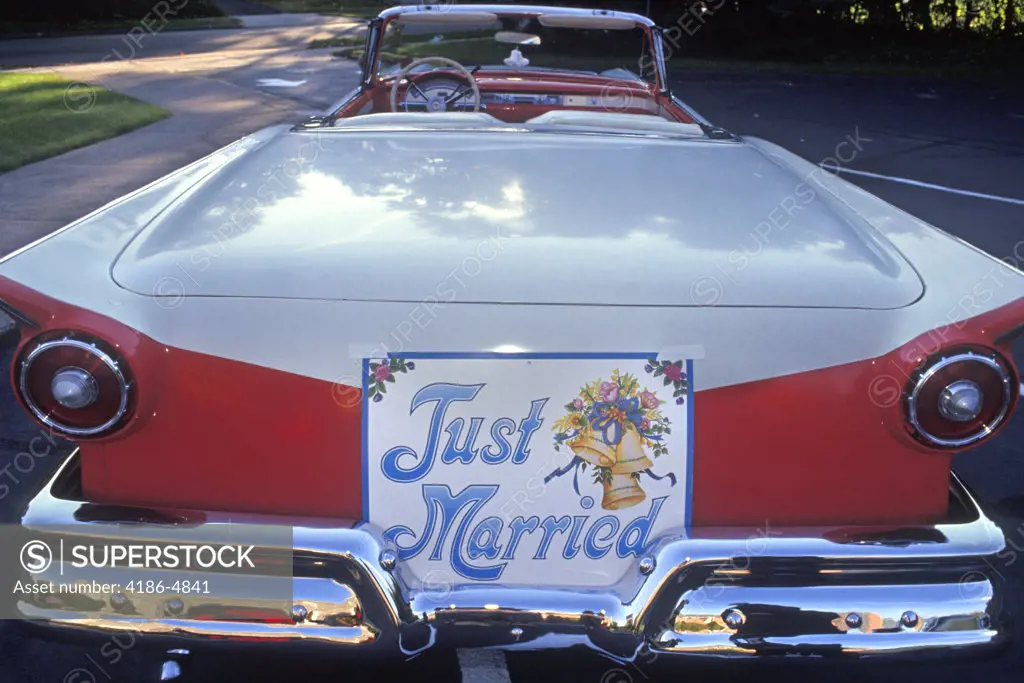 1950S Just Married Sign On Back Of Classic Ford Convertible Automobile