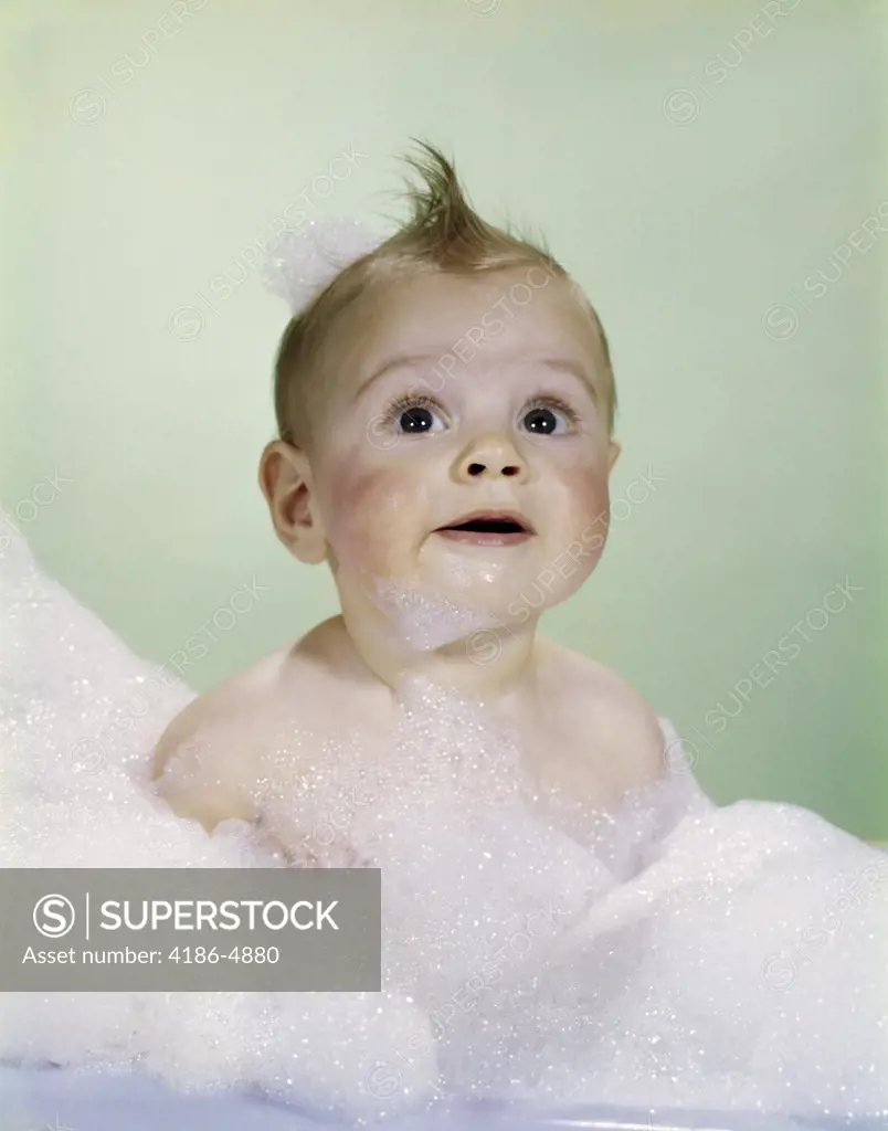 1960S Baby Sitting In Bath Surrounded By Suds