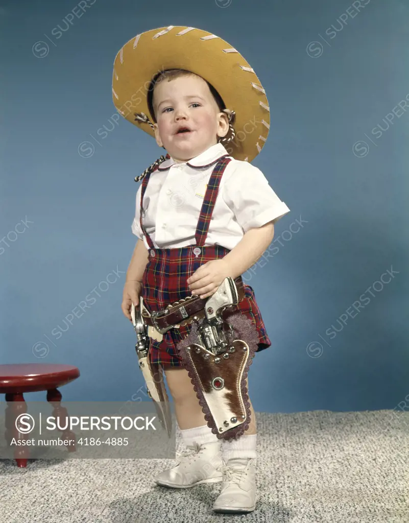 1950S 1960S Little Boy Wearing Cowboy Hat And Two Six Gun Cap Pistols Holsters Standing With Attitude
