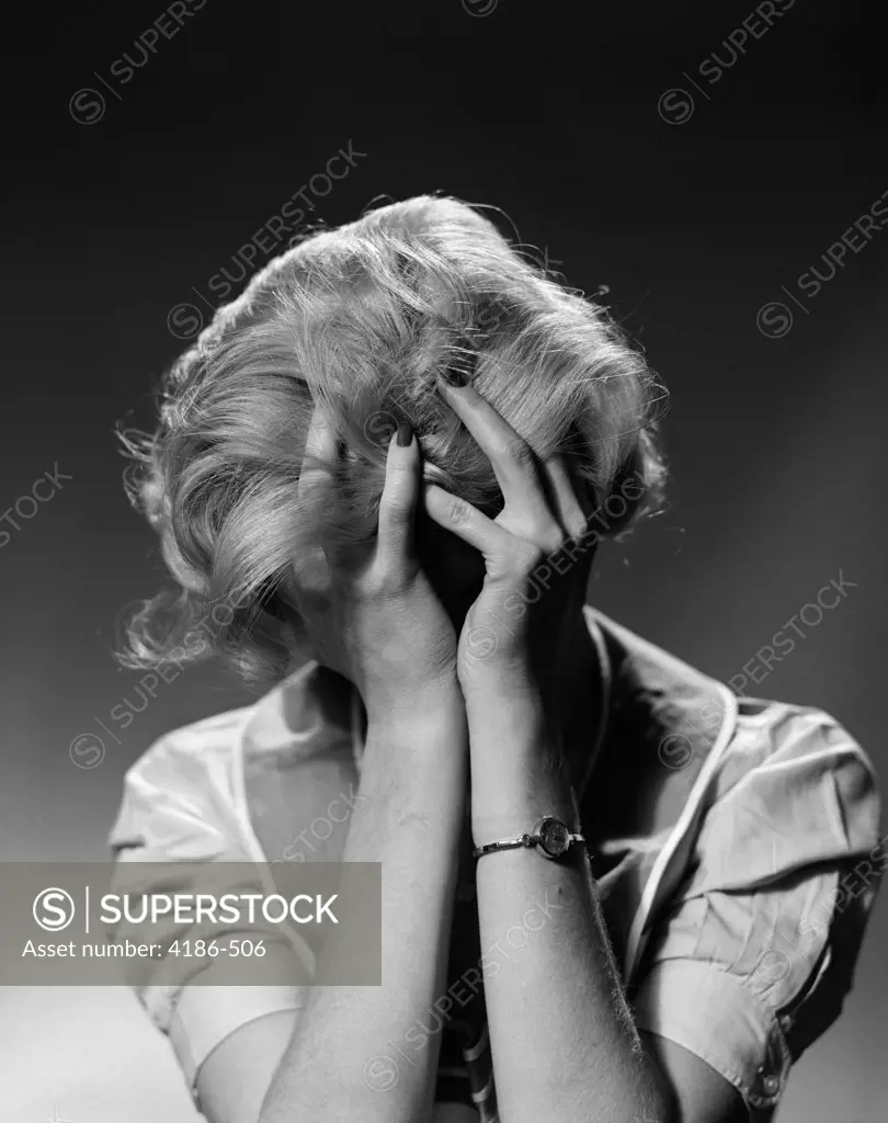 1950S Blond Woman With Headache Holding Head In Hands