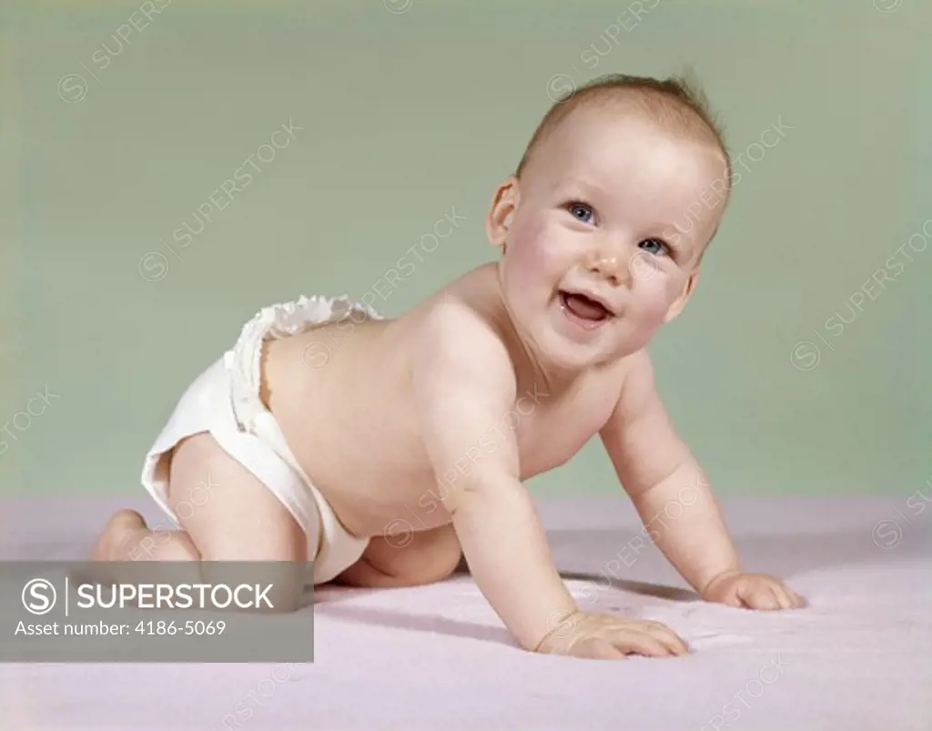 1960S Smiling Baby Wearing Diaper Crawling On Blanket