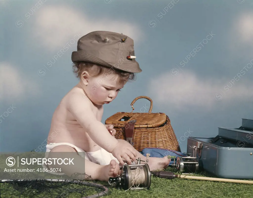 1960S Baby Ready To Go Fishing Wearing Hat Surrounded By Tackle Box Fishing Rod Net Basket