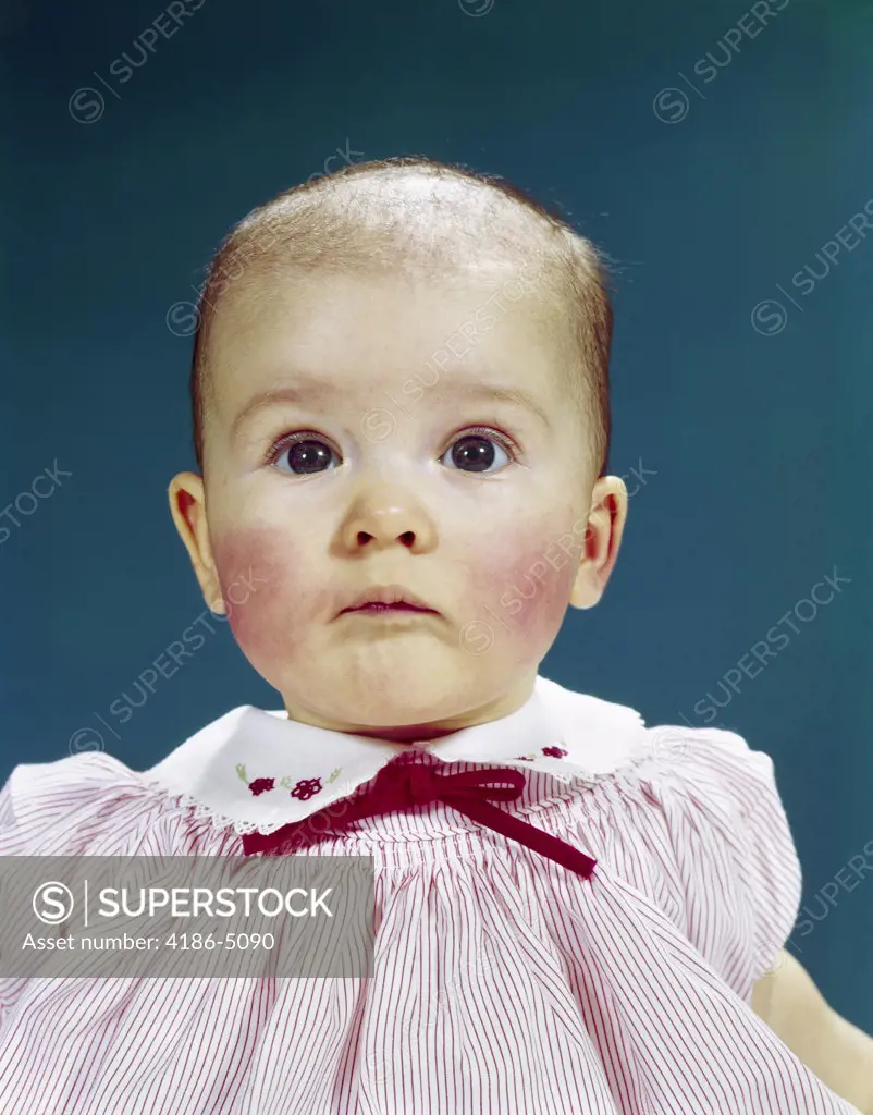 1960S Portrait Baby Girl Silly Facial Expression Red Bow At Collar