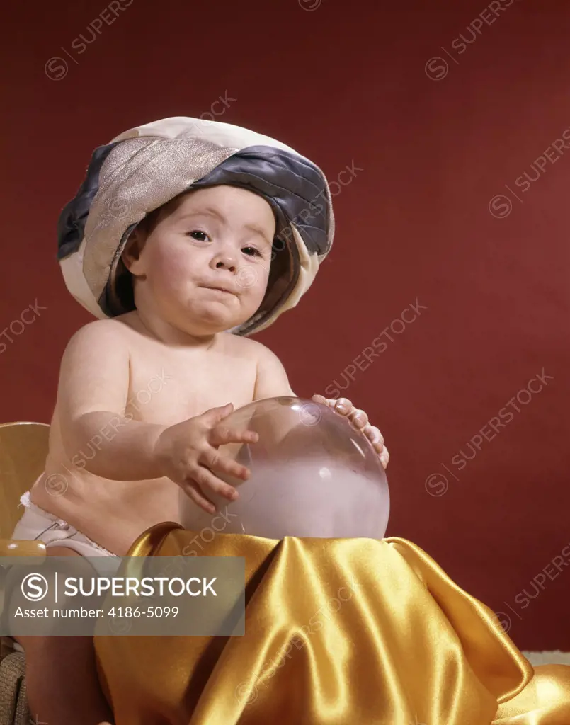 Baby With Fortune Teller Turban Headdress Holding Hands On Crystal Ball Studio