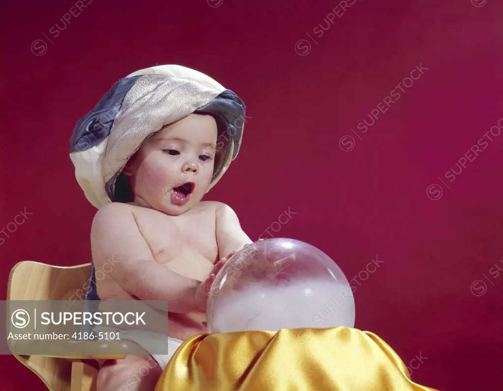 1960S Baby Fortune Teller Wearing Turban Seated With Crystal Ball