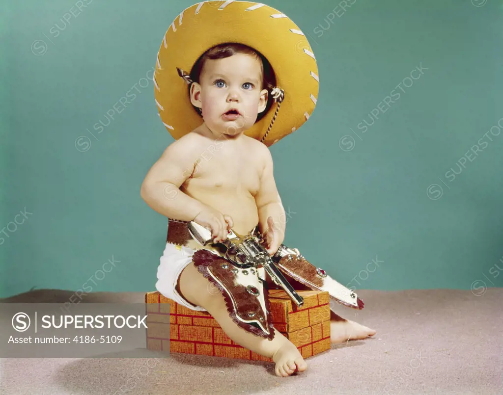 1960S Baby Wearing Cowboy Hat And Holster With Guns Pistols