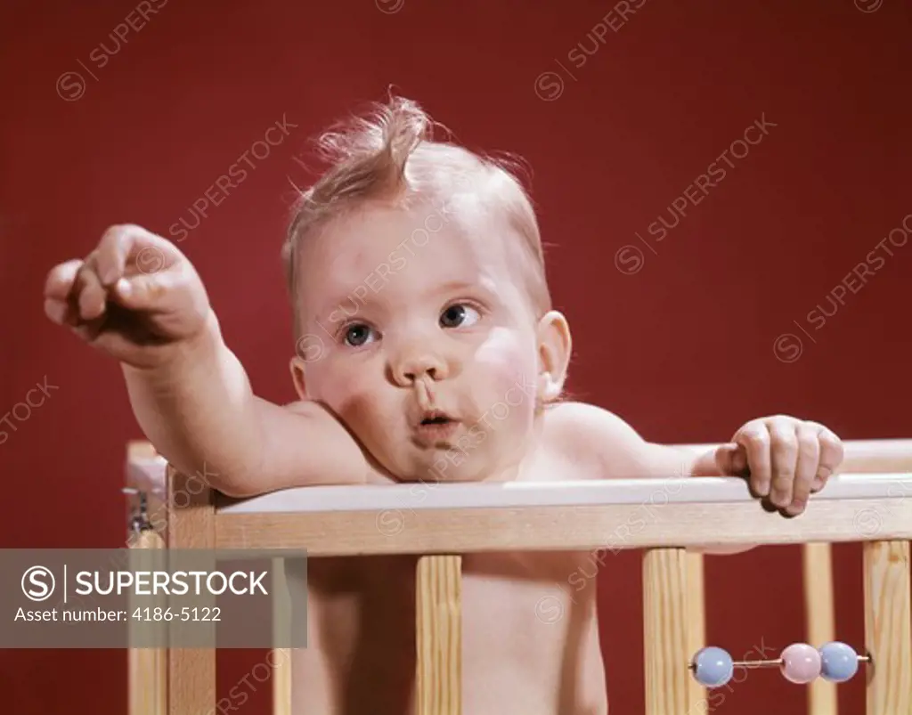 1960S Baby Reaching Out From Crib