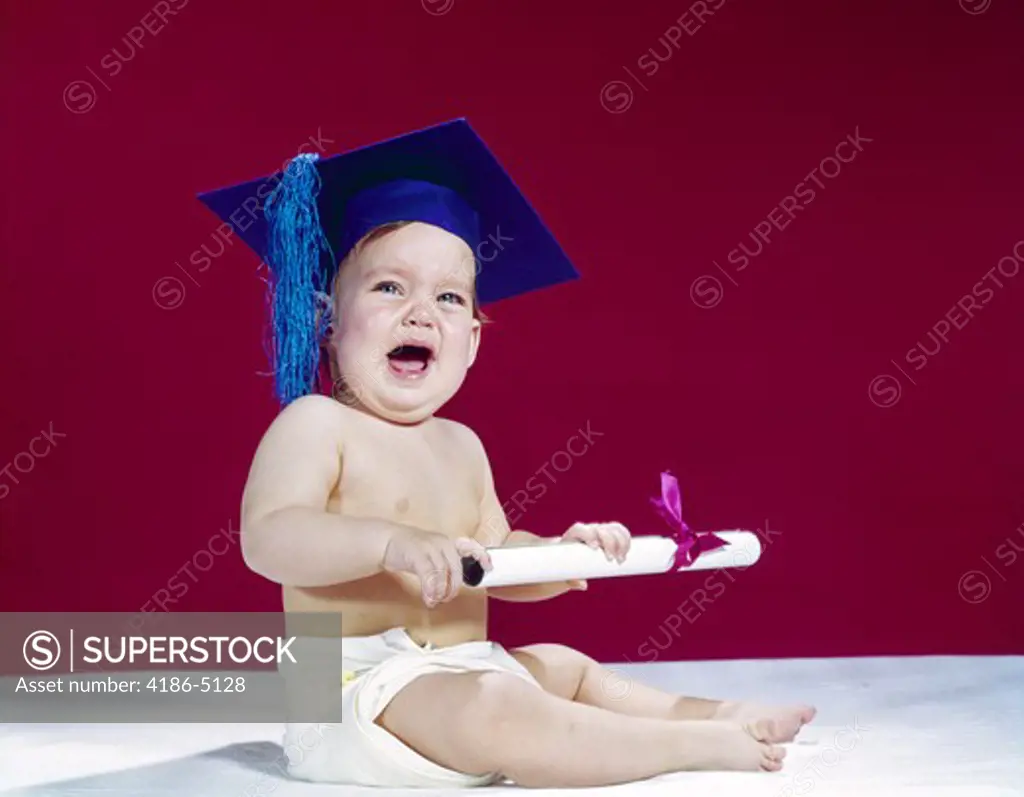 1960S Crying Baby Holding Diploma Wearing Graduation Cap 