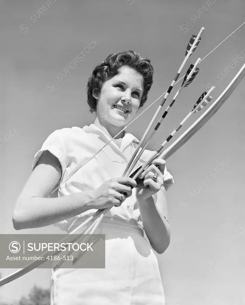1950S Smiling Teenage Woman Holding Bow And Arrows Wearing White Blouse Sports Recreation 