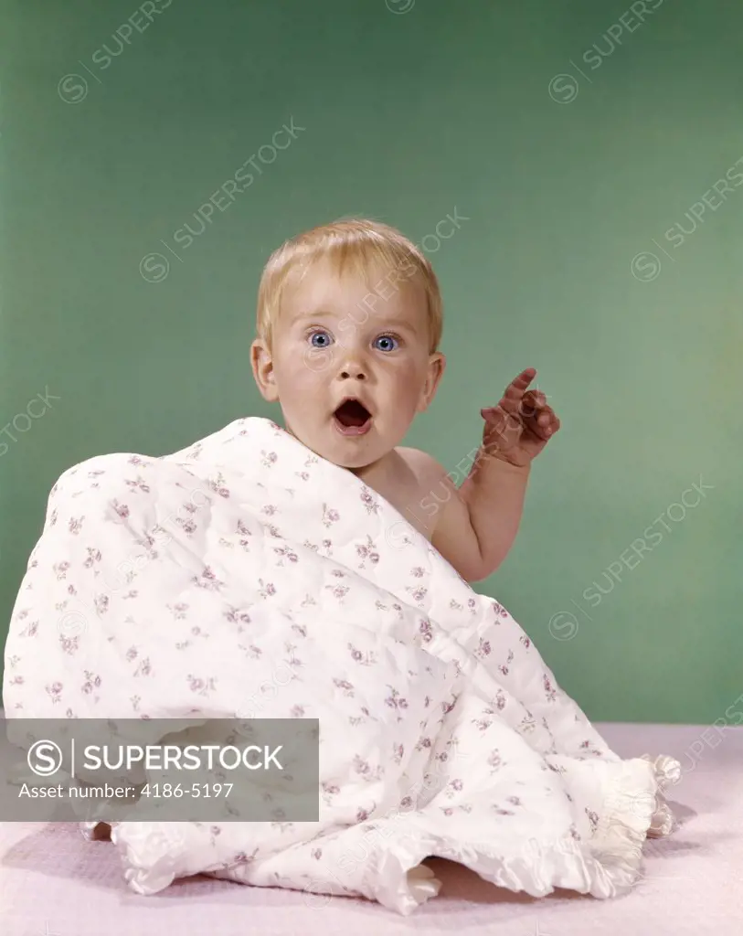 1960S Baby Partially Covered By Printed Blanket