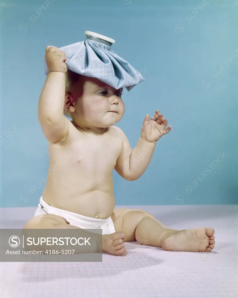 1960S Baby Sitting With Ice Pack On Top Of Head