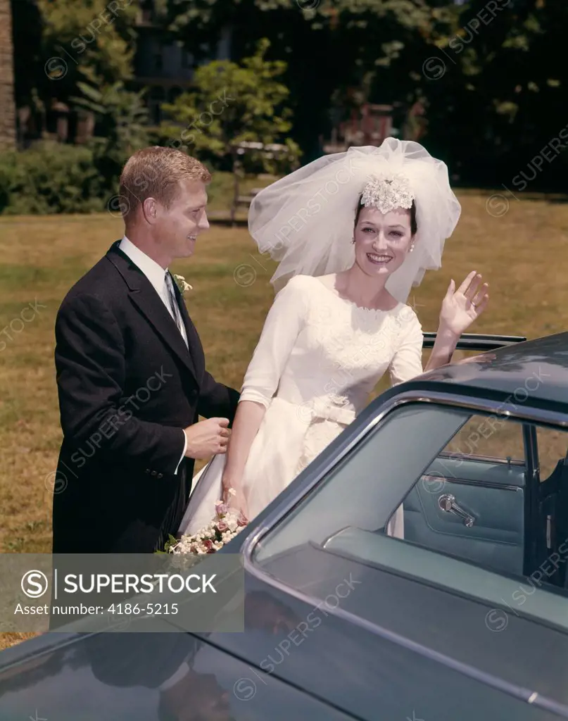 1960S Couple Bride & Groom Getting Into Car After Wedding 