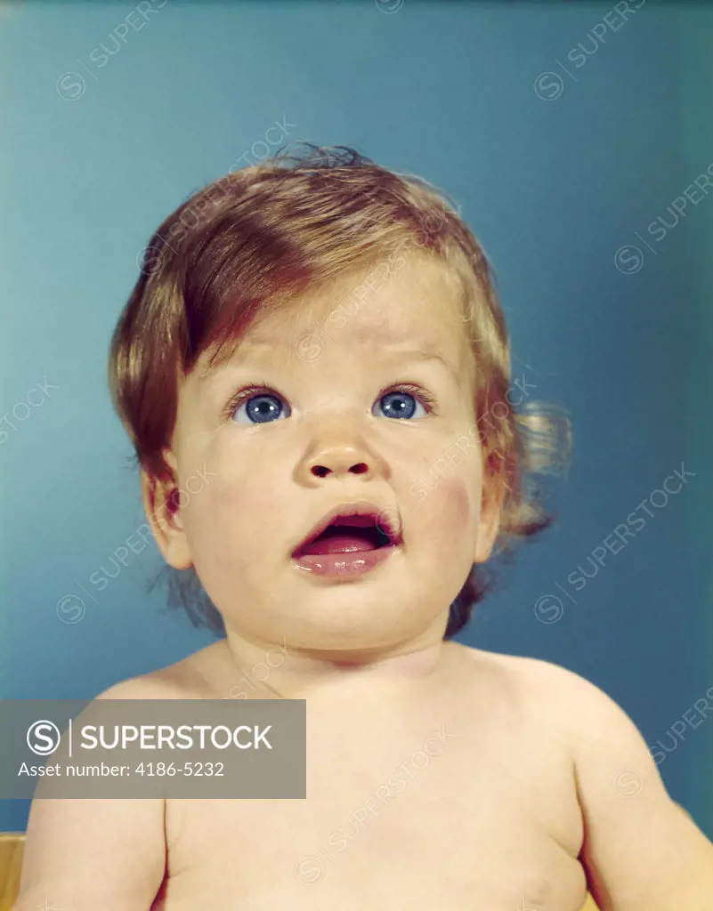 1960S Portrait Baby With Uncertain Inquisitive Facial Expression