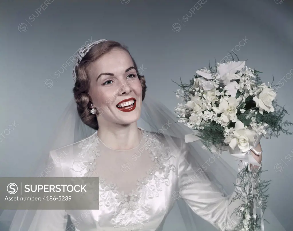 1950S Blond Bride Smiling Holding About To Throw White Bridal Bouquet Flowers Gown Lace Veil Fashion