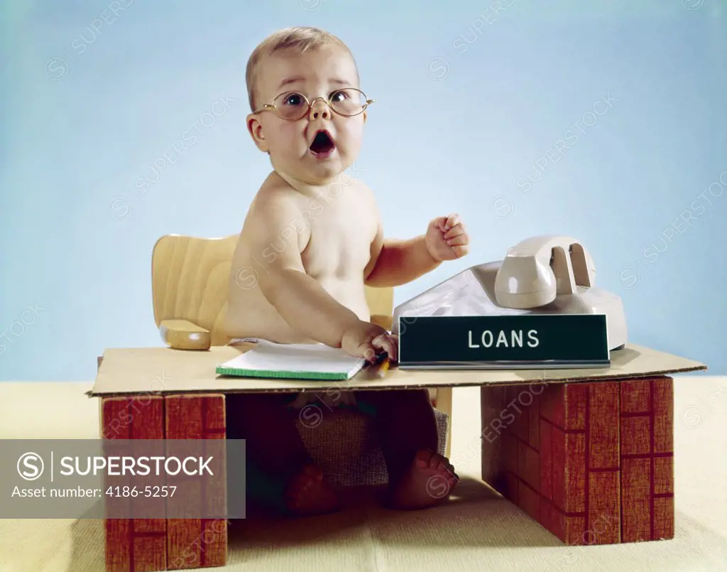 1960S Baby Businessman Sitting At Toy Desk Loans Sign Wearing Eyeglasses