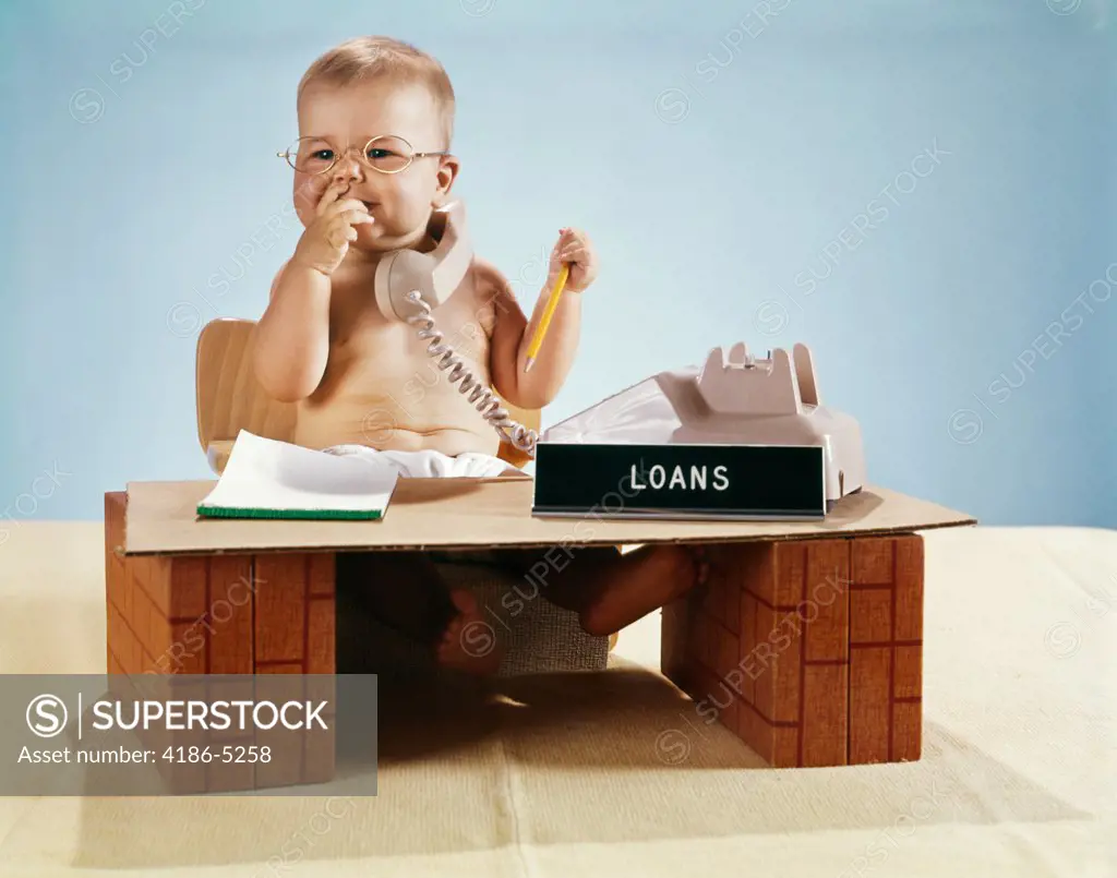 1960S Baby Businessman Diaper Sitting At Loan Desk Wearing Eyeglasses Talking On Telephone