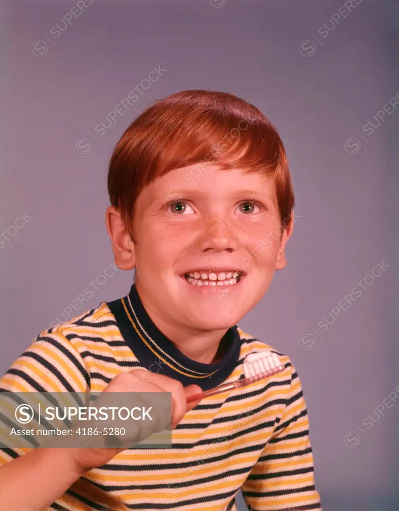 1960S Smiling Happy Boy Red Hair Striped Tee Shirt Holding Toothbrush Brushing Teeth  