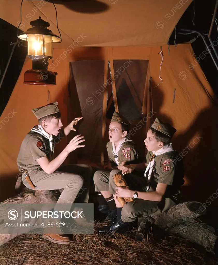 1950S Three Boy Scouts At Night Sitting By Tent Telling Scary Ghost Stories