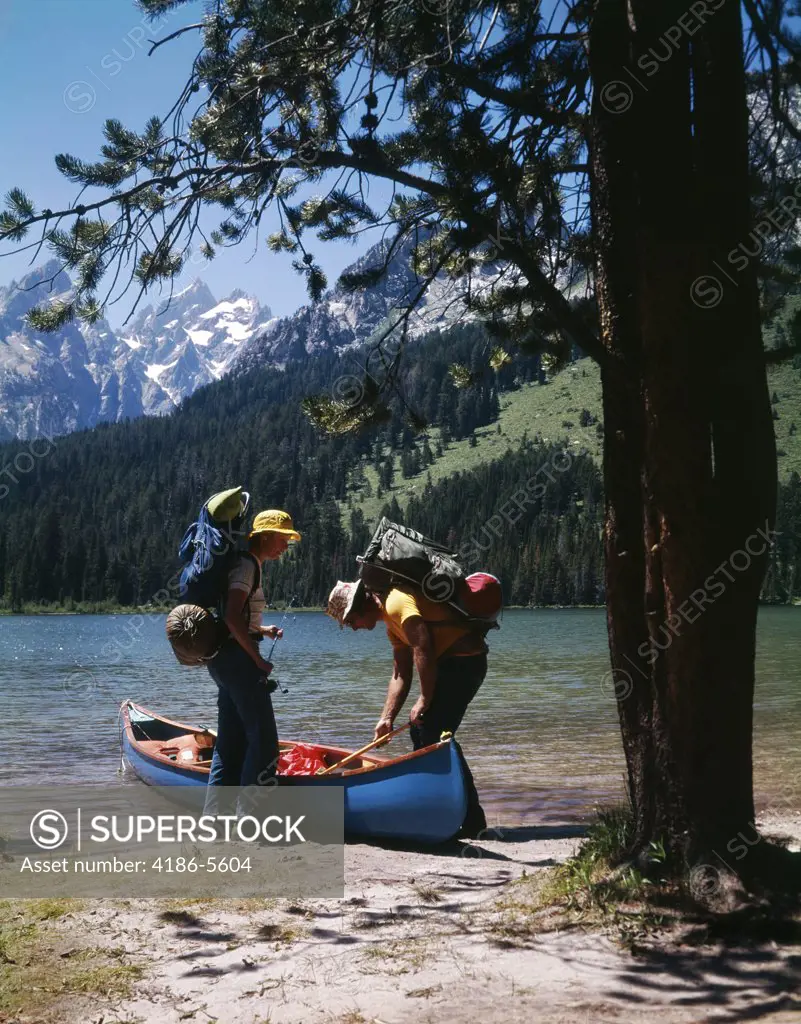 1970S Couple With Fishing Gear Canoe By String Lake  Grand Teton National Park Wyoming