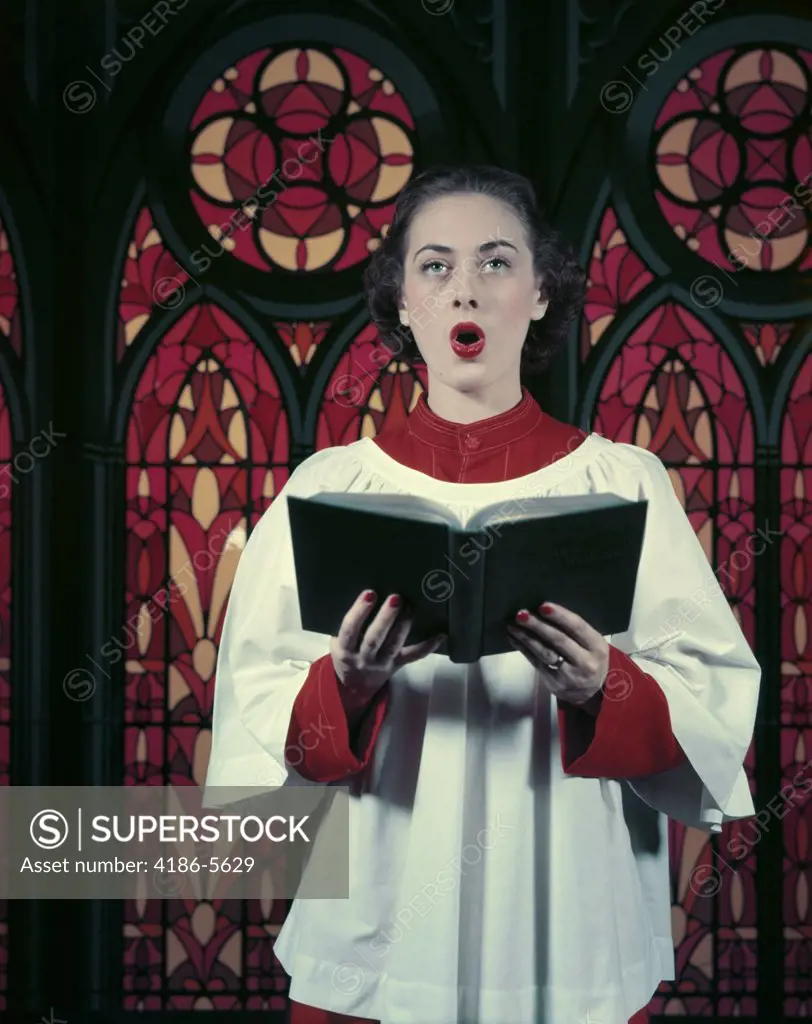 1950S Brunette Woman Red White Choir Robes Singing Holding Music Hymn Book Stained Glass Background Praise Song