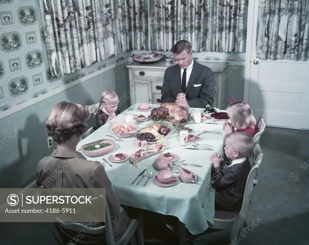 1950S Family Saying Grace Before Thanksgiving Turkey Dinner Mother Father 3 Children