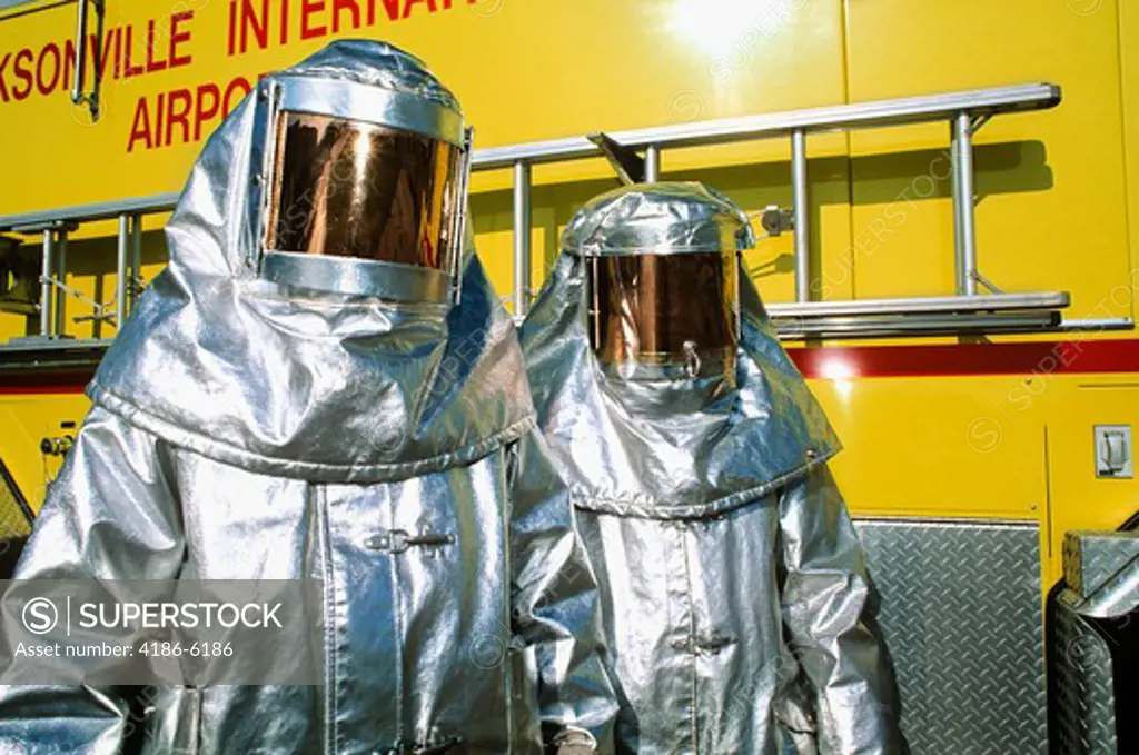 1990S Two Fire Fighters In Silver Full Body Protective Suits