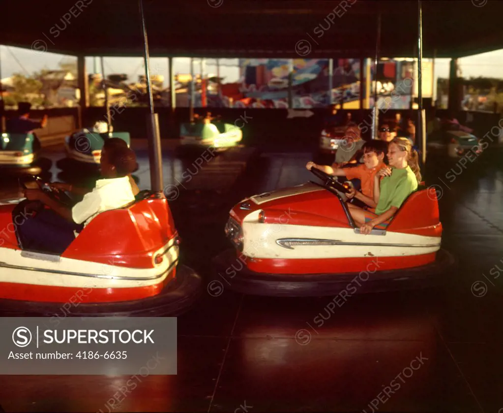 1970S Children Boys Girls Riding Bumper Cars Ride At Amusement Park  
