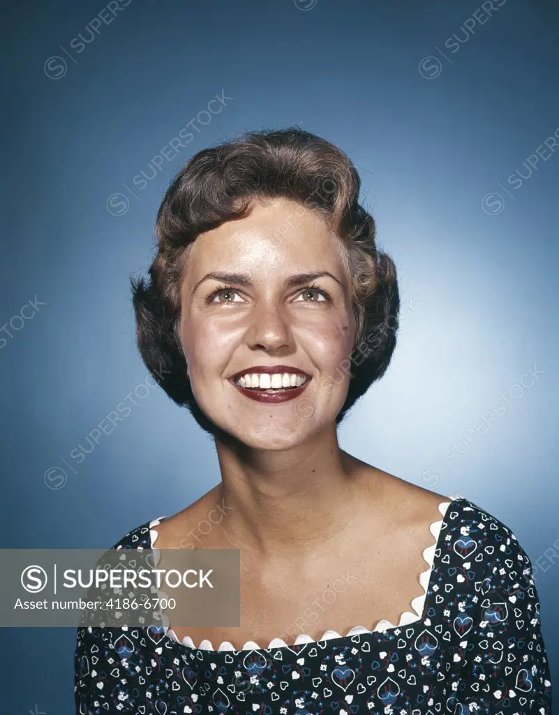 1960S Smiling Brunette Woman In Print Dress Looking Up  