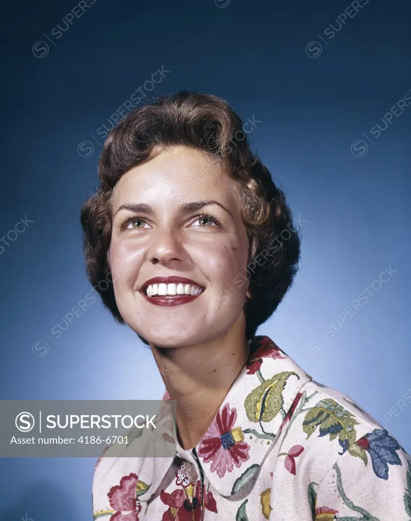 1960S Smiling Woman In White Print Dress Looking Up Studio