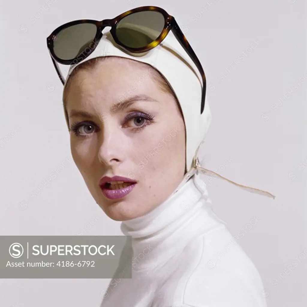 1970S Portrait Woman White Turtle Neck White Aviator Helmet Hat Strap Fashion Beauty Style Sunglasses Push Up On Head