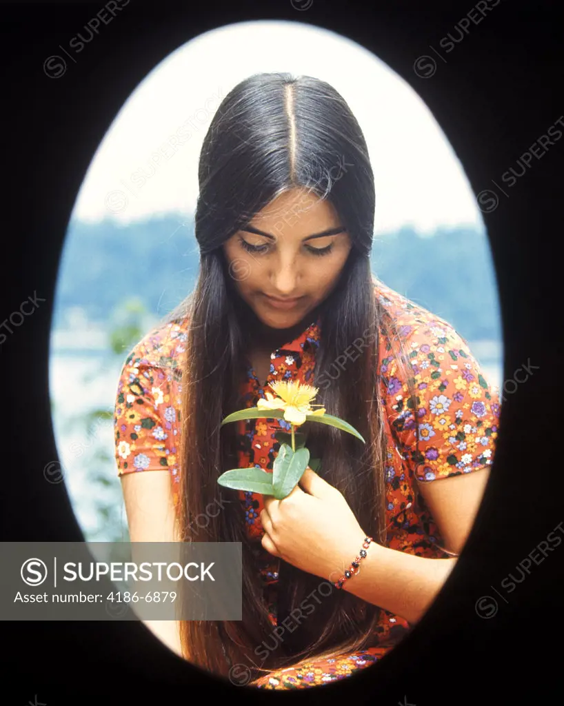 1970S Oval Vignette Teen Teenage Teenager Girl Moody Expression Holding Yellow Flower