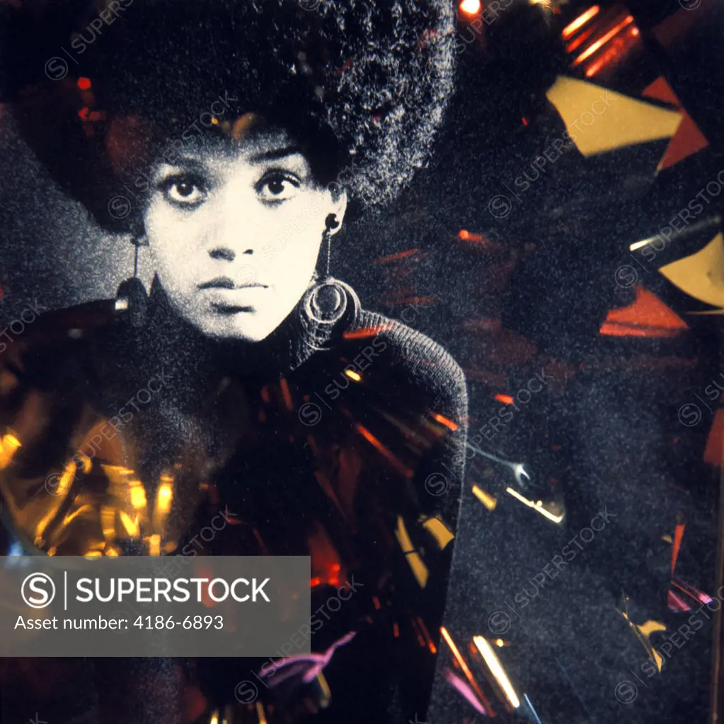 1960S 1970S Fashion Portrait Serious African American Woman Large Afro Hair Style Hoop Earrings Special Effect Lighting