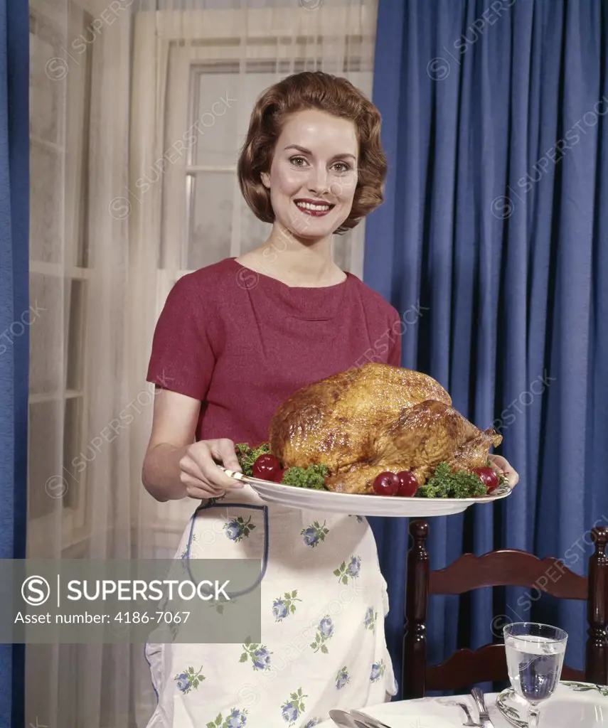 1960S Smiling Woman Serving Thanksgiving Turkey Dinner