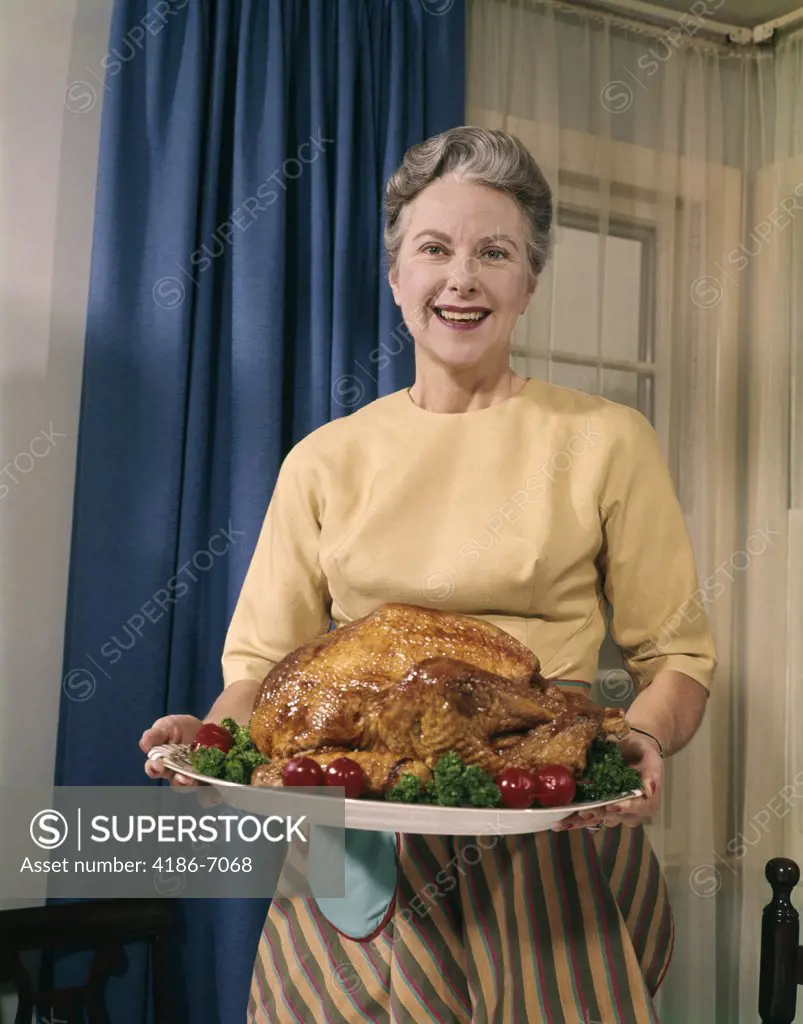 1960S Senior Woman Serving Platter Roasted Turkey  