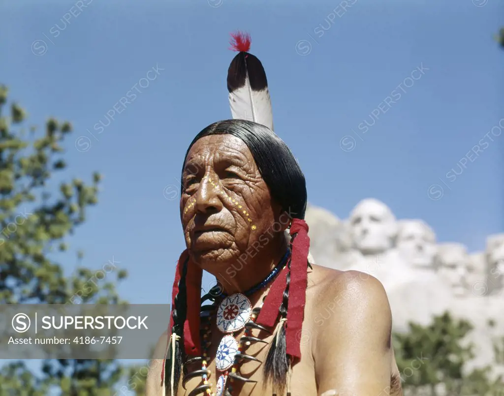 Sioux Indian In The Black Hills Mount Rushmore In Background